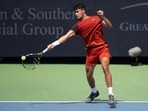 Carlos Alcaraz of Spain returns a shot during his match against Gael Monfils of France on day five of the Cincinnati Open