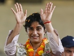 Supporters welcome with flowers to Wrestler Vinesh Phogat upon her arrival at IGI airport to her village at Dwarka Expressway in New Delhi