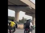 The men were seen doing wheeling on roads, later they were arrested by the Bengaluru Police. The men were seen doing wheeling on roads, later they were arrested by the Bengaluru Police.