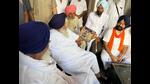 SAD president Sukhbir Singh Badal looking at a picture of his father with people of the constituency during a meeting on Sunday. (HT Photo) SAD president Sukhbir Singh Badal looking at a picture of his father with people of the constituency during a meeting on Sunday. (HT Photo)