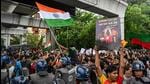 Supporters of arch-rival football clubs East Bengal and Mohun Bagan hold joint protest to condemn the rape and murder of a doctor in Kolkata on Sunday. (AFP)