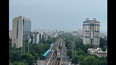 A Metro train en route to Millennium City Centre Metro station in Gurugram Sector 29 near Fortis Hospital on Sunday. (Parveen Kumar/HT Photo) A Metro train en route to Millennium City Centre Metro station in Gurugram Sector 29 near Fortis Hospital on Sunday. (Parveen Kumar/HT Photo)