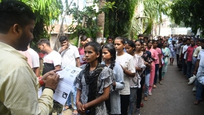 Officials check the particulars of candidates who are seen waiting to appear for Bihar Police Constable Exam in Patna. (Santosh Kumar) Officials check the particulars of candidates who are seen waiting to appear for Bihar Police Constable Exam in Patna. (Santosh Kumar)