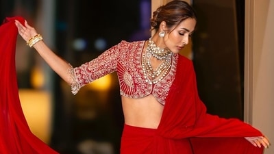 Malaika Arora wore a red saree outfit for one of the festival events she graced. She wrote in her caption, "Do the best you can until you know better. Then when you know better, do better." Malaika Arora wore a red saree outfit for one of the festival events she graced. She wrote in her caption, "Do the best you can until you know better. Then when you know better, do better."