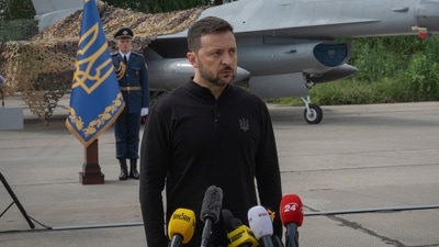 Ukraine's President Volodymyr Zelenskyy answers media questions standing against the background of Ukraine's Air Force's F-16 fighter jets in an undisclosed location in Ukraine, Sunday, Aug. 4, 2024. (AP) Ukraine's President Volodymyr Zelenskyy answers media questions standing against the background of Ukraine's Air Force's F-16 fighter jets in an undisclosed location in Ukraine, Sunday, Aug. 4, 2024. (AP)