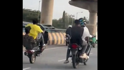 The men were seen doing wheeling on roads, later they were arrested by the Bengaluru Police. The men were seen doing wheeling on roads, later they were arrested by the Bengaluru Police.