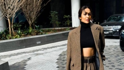 Malaika Arora wore a brown blazer and matching shirt look for another outing in Melbourne. She styled her look with a black crop top. Malaika Arora wore a brown blazer and matching shirt look for another outing in Melbourne. She styled her look with a black crop top.