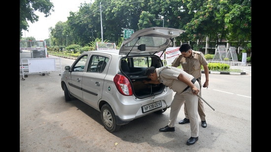 Panjab?university?security personnel?checking vehicles?at ?gate number 1 on the varsity campus. (Ravi Kumar/HT)