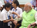 PM Narendra Modi celebrated the festival of Raksha Bandhan with children and students of various schools and organizations at Prime Minister residence , in New Delhi on Monday.( ) PM Narendra Modi celebrated the festival of Raksha Bandhan with children and students of various schools and organizations at Prime Minister residence , in New Delhi on Monday.( )