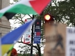 A banner of the Democratic National Convention (DNC) hangs as people take part in a protest organised by pro-abortion rights, pro-LGBT rights and pro-Palestinian activists, on the eve of DNC, in Chicago, Illinois, U.S., August 18, 2024.  REUTERS/Marco Bello