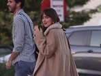Dakota Johson showing her engagement ring