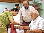 Qamar Mohsin Sheikh ties a Rakhi to Narendra Modi (File image)(HT ) Qamar Mohsin Sheikh ties a Rakhi to Narendra Modi (File image)(HT )