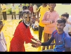 The woman can be seen in a tiger mask celebrating Rakhsha Bandhan, The woman can be seen in a tiger mask celebrating Rakhsha Bandhan,