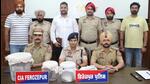 Ferozepur senior superintendent of police Saumya Mishra with the local CIA staff that arrested the two smugglers, both brothers from Zira, who were operating out of a house at New Purba village in the district, on Monday. (HT Photo) Ferozepur senior superintendent of police Saumya Mishra with the local CIA staff that arrested the two smugglers, both brothers from Zira, who were operating out of a house at New Purba village in the district, on Monday. (HT Photo)