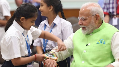 PM Narendra Modi celebrated the festival of Raksha Bandhan with children and students of various schools and organizations at Prime Minister residence , in New Delhi on Monday. ( )