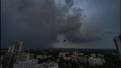 Dark clouds hover over Connaught Place on Monday evening. (Raj K Raj/HT Photo)