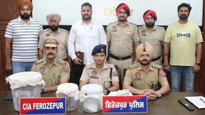 Ferozepur senior superintendent of police Saumya Mishra with the local CIA staff that arrested the two smugglers, both brothers from Zira, who were operating out of a house at New Purba village in the district, on Monday. (HT Photo)