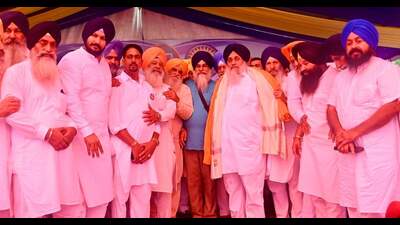 SAD president Sukhbir Singh Badal with terror-convict Gurdeep Singh Khera at the party’s event during Rakhar Punya Mela at Baba Bakala on Monday. (HT Photo) SAD president Sukhbir Singh Badal with terror-convict Gurdeep Singh Khera at the party’s event during Rakhar Punya Mela at Baba Bakala on Monday. (HT Photo)