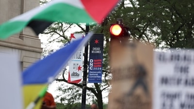 A banner of the Democratic National Convention (DNC) hangs as people take part in a protest organised by pro-abortion rights, pro-LGBT rights and pro-Palestinian activists, on the eve of DNC, in Chicago, Illinois, U.S., August 18, 2024.  REUTERS/Marco Bello (REUTERS)