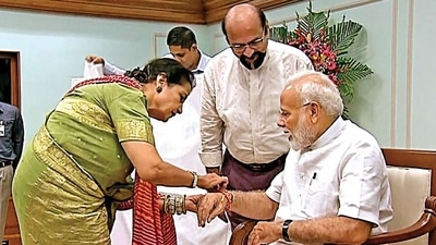 Qamar Mohsin Sheikh ties a Rakhi to Narendra Modi (File image) (HT ) Qamar Mohsin Sheikh ties a Rakhi to Narendra Modi (File image) (HT )