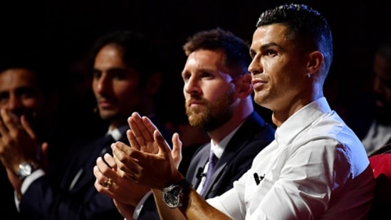 Cristiano Ronaldo and Lionel Messi during a ceremony.