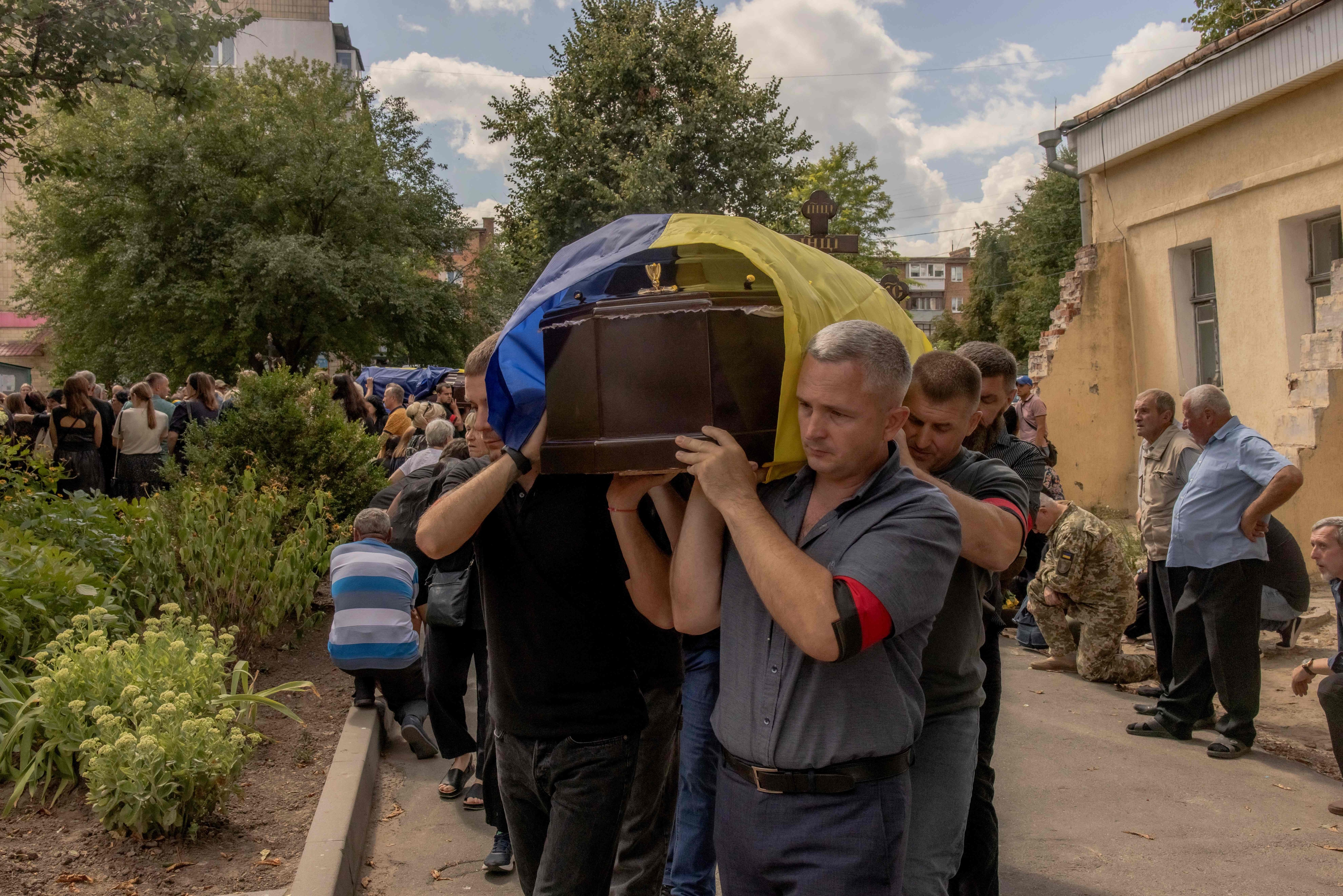 Men carry a coffin during the funeral of six Ukrainian servicemen, who were killed since Ukraine launched its offensive at the Russian border region of Kursk, in Sumy, northeastern Ukraine, on August 15. (AFP) Men carry a coffin during the funeral of six Ukrainian servicemen, who were killed since Ukraine launched its offensive at the Russian border region of Kursk, in Sumy, northeastern Ukraine, on August 15. (AFP)
