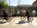 Police on bikes ride by a section of newly reenforced fencing around the United Center at the Democratic National Convention Tuesday, Aug. 20, 2024, in Chicago. (AP Photo/Julio Cortez)(AP) Police on bikes ride by a section of newly reenforced fencing around the United Center at the Democratic National Convention Tuesday, Aug. 20, 2024, in Chicago. (AP Photo/Julio Cortez)(AP)
