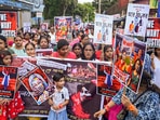 Artists and others take part in a protest against the alleged sexual assault and murder of a postgraduate trainee doctor in Kolkata, at Balurghat in Dakshin Dinajpur district, Monday, Aug. 19, 2024. (PTI Photo)
