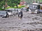 Delhi NCR Rains: Commuters step out during morning rain at ITO and ring road. Delhi NCR Rains: Commuters step out during morning rain at ITO and ring road.