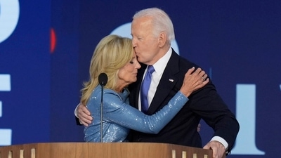 President Joe Biden kisses first lady Jill Biden after speaking at the Democratic National Convention on Monday, Aug. 19, 2024, in Chicago. AP/PTI(AP08_20_2024_000117A) (AP) President Joe Biden kisses first lady Jill Biden after speaking at the Democratic National Convention on Monday, Aug. 19, 2024, in Chicago. AP/PTI(AP08_20_2024_000117A) (AP)