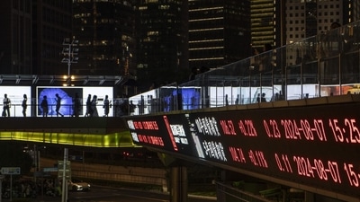 An electronic ticker displays stock figures in Shanghai, China. (Bloomberg)