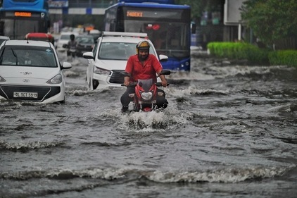 Commuters step out during morning rain , at ITO India, on Tuesday, August 20, 2024. (Photo by Raj j K Raj / Hindustan Times) Commuters step out during morning rain , at ITO India, on Tuesday, August 20, 2024. (Photo by Raj j K Raj / Hindustan Times)