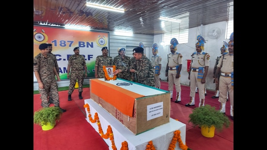 CRPF officials pay their last respects to the mortal remains of CRPF inspector Kuldeep Kumar, who lost his life in the Udhampur encounter on August 19, in Udhampur on Tuesday. (ANI)