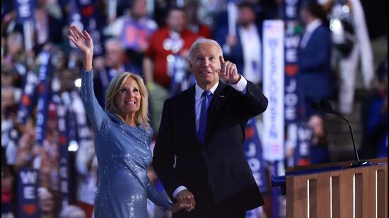 First Lady Jill Biden and US President Joe Biden wave to the audience during the first day of the Democratic National Convention at the United Center in Chicago, Illinois, on Monday. (AFP)