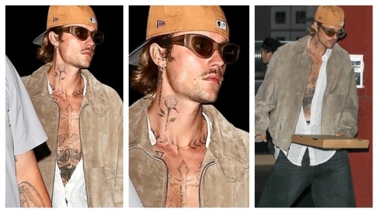 Justin Bieber effortlessly mastered the casual, laid-back aesthetic. His outfit featured a loose white shirt, unbuttoned to reveal his tattooed chest, layered under a brown velvet jacket. He paired it with black, baggy pants and accessorized with brown shades and a backward baseball cap.(Instagram/@justjared)