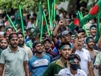 Protesters hold national flags as they march to block the house of Sheikh Mujibur Rahman. (AFP) Protesters hold national flags as they march to block the house of Sheikh Mujibur Rahman. (AFP)