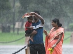 Visitors at Kartavya Path amid monsoon rain in New Delhi, India. (Photo by Sanjeev Verma/Hindustan Times)