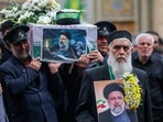 A member of a honour guards weeps while carrying the coffin of Iran's President Ebrahim Raisi during a funeral procession in Qom.(AFP) A member of a honour guards weeps while carrying the coffin of Iran's President Ebrahim Raisi during a funeral procession in Qom.(AFP)