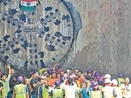 Workers take photos after the breakthrough of the tunnel boring machine at Chhattarpur Mandir project site on Wednesday. (Vipin Kumar/HT PHOTO) Workers take photos after the breakthrough of the tunnel boring machine at Chhattarpur Mandir project site on Wednesday. (Vipin Kumar/HT PHOTO)