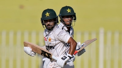 Pakistan's Saud Shakeel, front, and Saim Ayub run between the wicket during the first day of first cricket test match between Pakistan and Bangladesh (AP) Pakistan's Saud Shakeel, front, and Saim Ayub run between the wicket during the first day of first cricket test match between Pakistan and Bangladesh (AP)