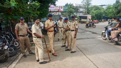 Police personnel stand guard after two kindergarten girls were allegedly sexually abused at a school at Badlapur. (PTI) Police personnel stand guard after two kindergarten girls were allegedly sexually abused at a school at Badlapur. (PTI)