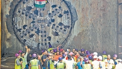 Workers take photos after the breakthrough of the tunnel boring machine at Chhattarpur Mandir project site on Wednesday. (Vipin Kumar/HT PHOTO) Workers take photos after the breakthrough of the tunnel boring machine at Chhattarpur Mandir project site on Wednesday. (Vipin Kumar/HT PHOTO)