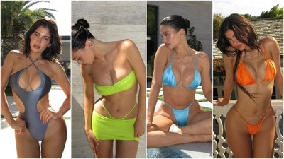 Kylie Jenner promoted her brand Khy by dropping pictures of herself dressed in sultry swimsuits. The beauty mogul wore a metallic grey cut-out one-piece featuring a halter neckline. Kylie also wore a neon green bandeau bikini top and paired it with a micro-mini skirt and ruched bikini bottoms. She donned metallic blue and orange ruched bikini sets in the last two photos. (Instagram) Kylie Jenner promoted her brand Khy by dropping pictures of herself dressed in sultry swimsuits. The beauty mogul wore a metallic grey cut-out one-piece featuring a halter neckline. Kylie also wore a neon green bandeau bikini top and paired it with a micro-mini skirt and ruched bikini bottoms. She donned metallic blue and orange ruched bikini sets in the last two photos. (Instagram)