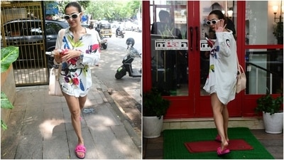 Malaika Arora stepped out for a salon date in the city wearing a comfy yet chic co-ord set featuring a printed white shirt and matching shorts. She styled the ensemble with pink lip-on sandals, sunglasses, a tote bag, and a top knot. (HT Photo/Varinder Chawla) Malaika Arora stepped out for a salon date in the city wearing a comfy yet chic co-ord set featuring a printed white shirt and matching shorts. She styled the ensemble with pink lip-on sandals, sunglasses, a tote bag, and a top knot. (HT Photo/Varinder Chawla)