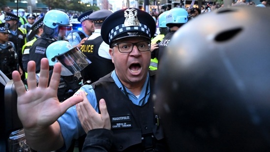 Demonstrators clash with police near the Israeli Consulate during the Democratic National Convention Tuesday, Aug. 20, 2024, in Chicago. (AP Photo/Noah Berger) (AP)