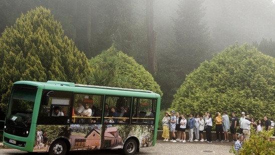 Tourists queue to catch a shuttle bus from the gate up to the the 19th century Pena Palace. (AP) Tourists queue to catch a shuttle bus from the gate up to the the 19th century Pena Palace. (AP)