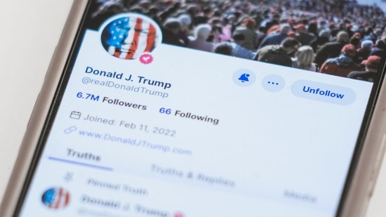 The Truth Social account for former President Donald Trump is seen on a mobile device. (AP Photo/John Minchillo, File)(AP)