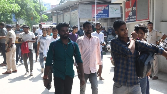 Candidates coming out of exam centre after appearing for A N College in Patna. (Santosh Kumar )