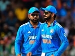 India's Virat Kohli (R) and captain Rohit Sharma gestures during a match. India's Virat Kohli (R) and captain Rohit Sharma gestures during a match.