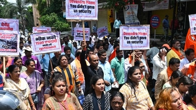 Thane, India. Aug 21, 2024: Workers of the Shiv Sena Party (UBT) held protest against the alleged sexual assault of two four-year-old girls by a cleaning staff member in a Badlapur school and Shiv Sena's (Shinde faction) leader verbally abused a news reporter. Thane, (Photo by Raju Shinde/HT Photo) Thane, India. Aug 21, 2024: Workers of the Shiv Sena Party (UBT) held protest against the alleged sexual assault of two four-year-old girls by a cleaning staff member in a Badlapur school and Shiv Sena's (Shinde faction) leader verbally abused a news reporter. Thane, (Photo by Raju Shinde/HT Photo)